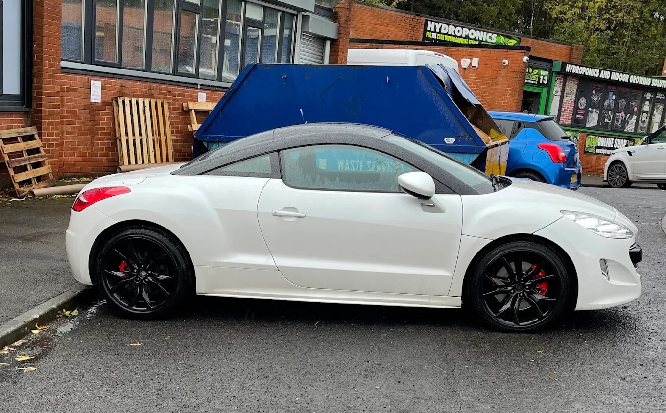 White Peugeot with gloss black alloy wheels