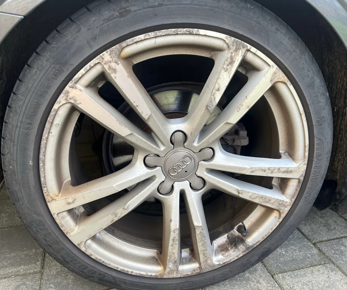 Worn Audi alloy wheel before refurbishment